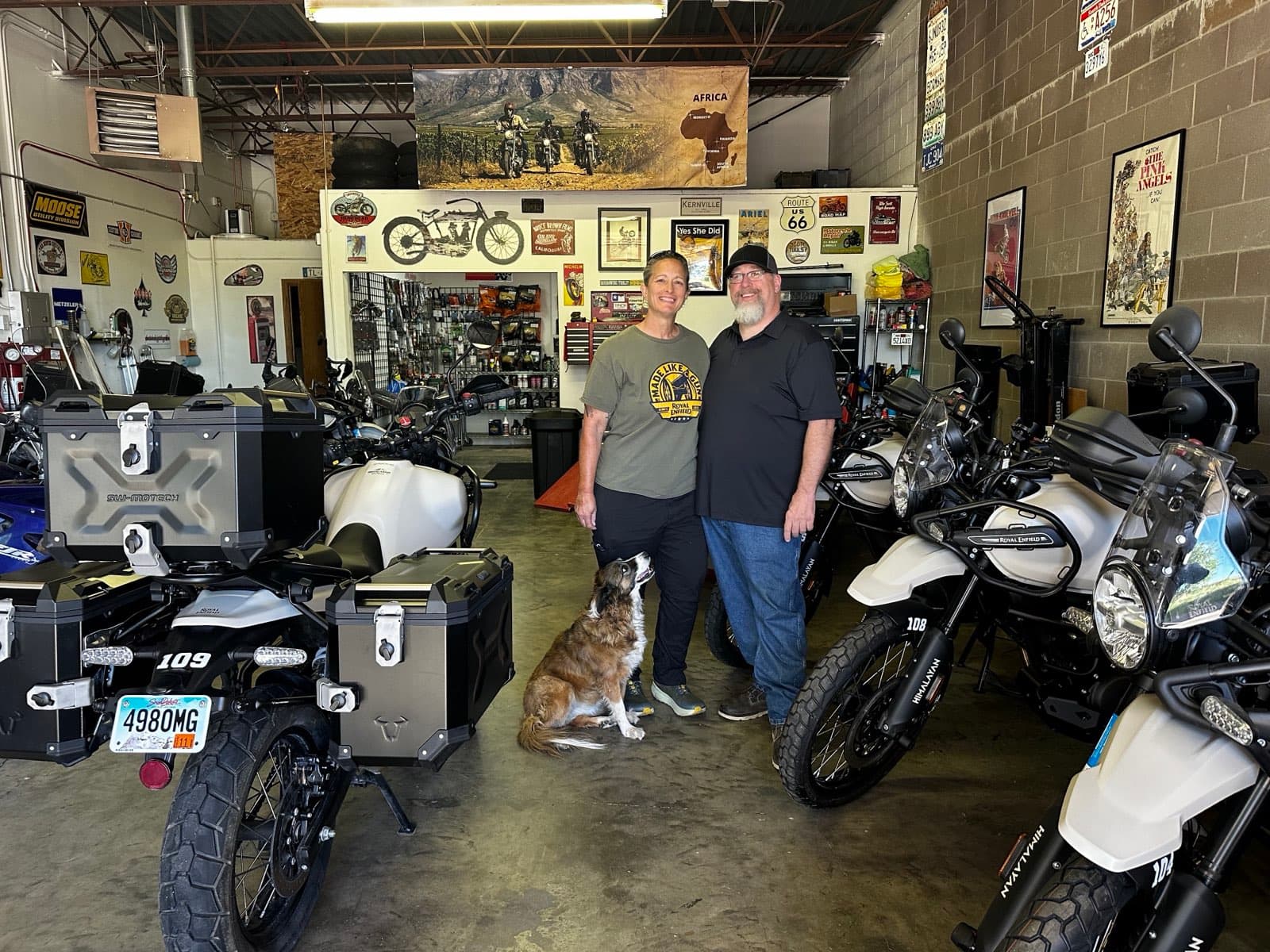 Mike and Wendy with their dog Katie in the Vintage Rides USA garage in Rapid City